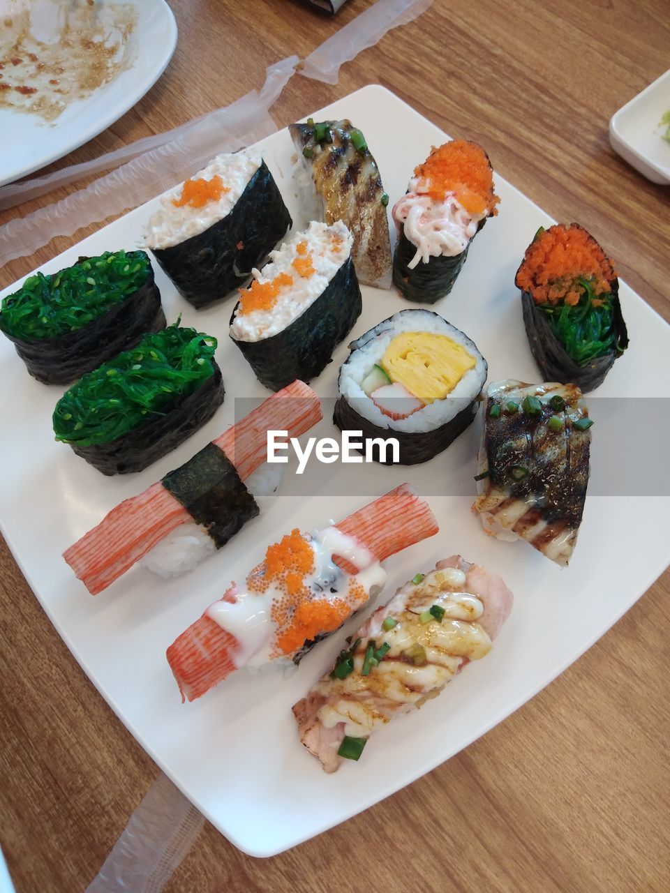 HIGH ANGLE VIEW OF SUSHI SERVED IN PLATE ON TABLE