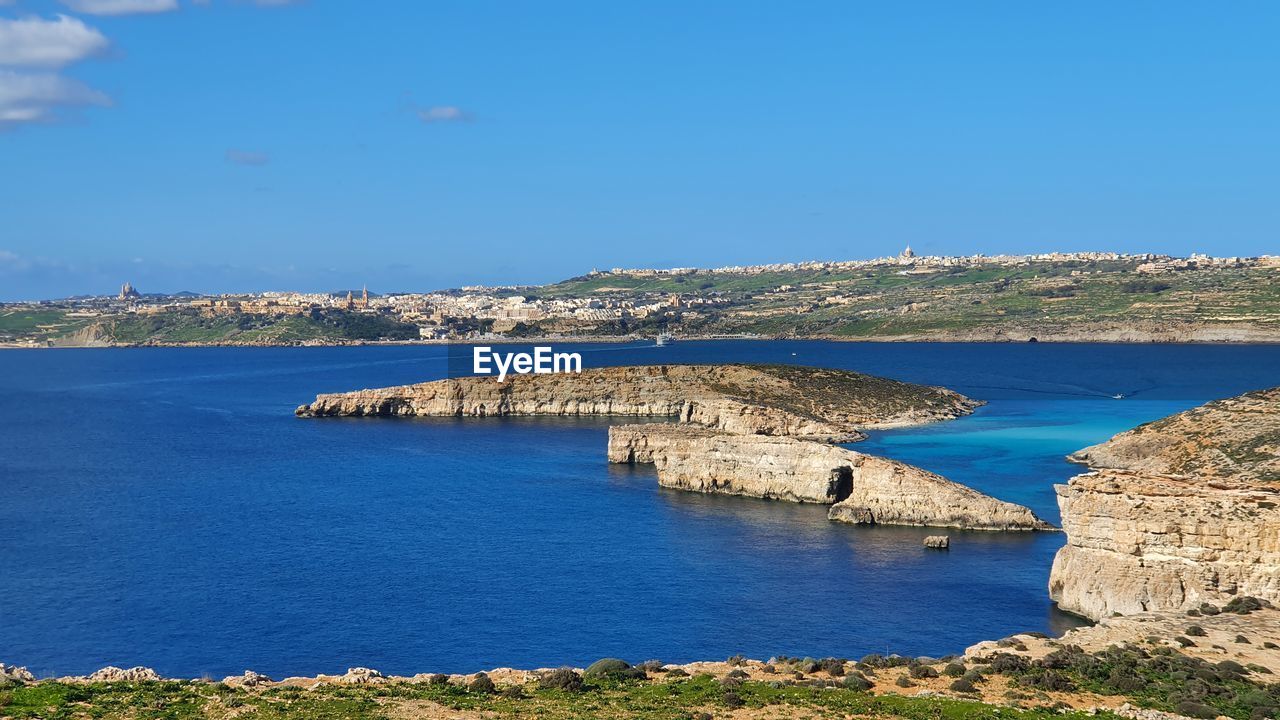 Scenic view of sea against clear blue sky