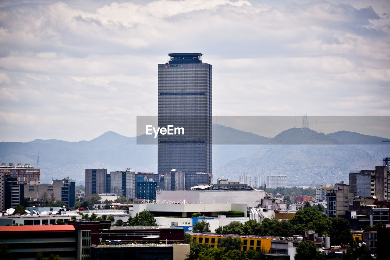 Modern buildings in city against sky