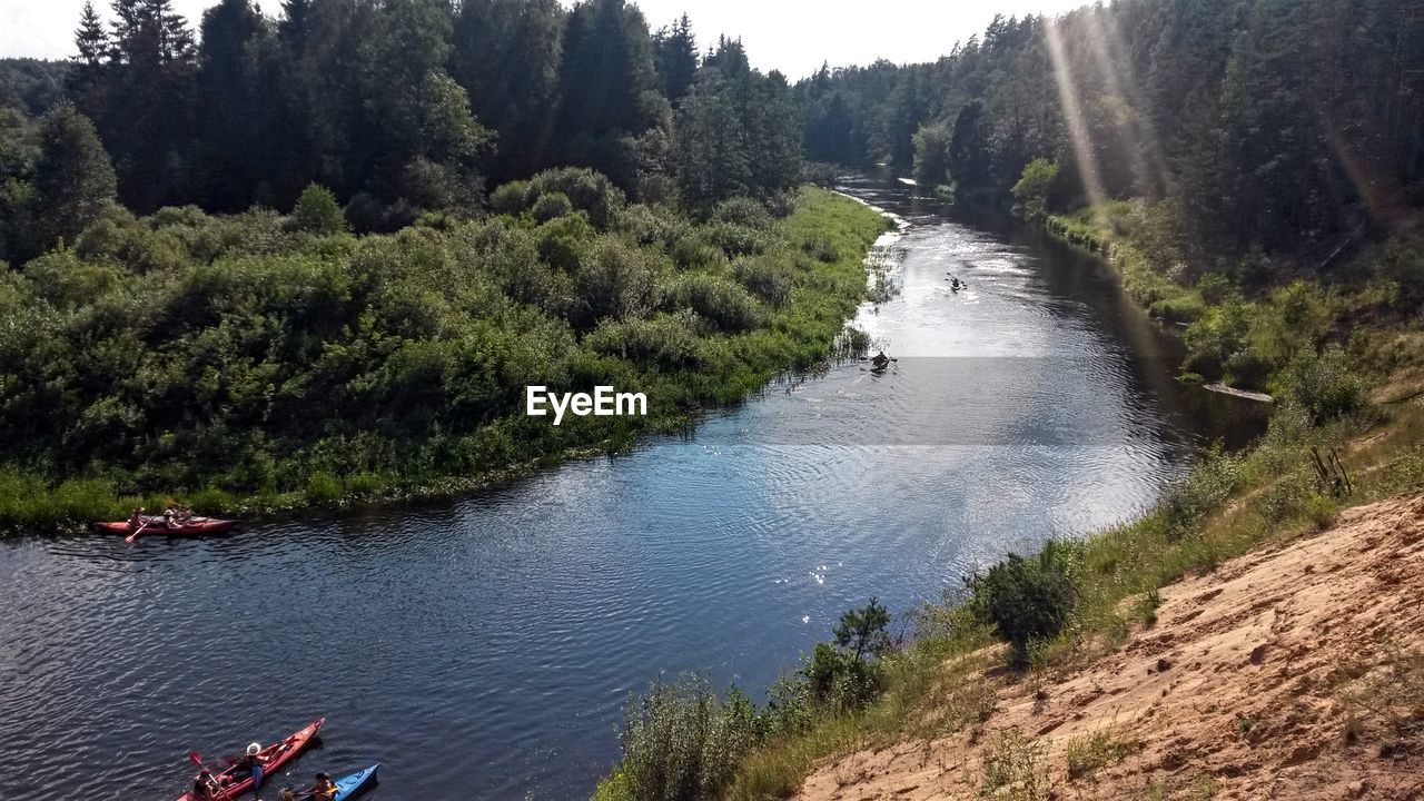 SCENIC VIEW OF STREAM AMIDST TREES AND LAKE AGAINST SKY