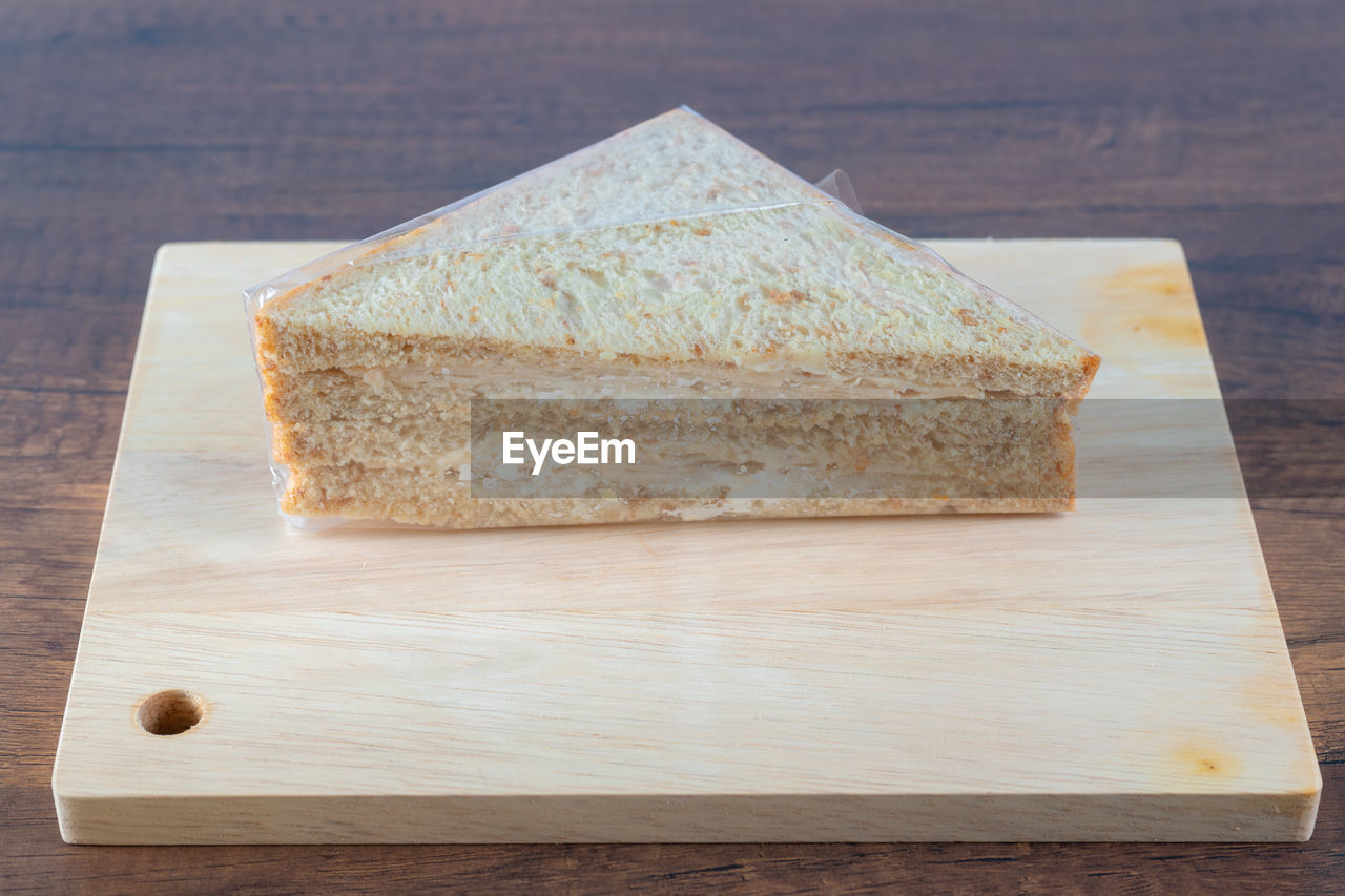 food and drink, food, wood, freshness, table, cutting board, indoors, no people, dessert, slice, still life, studio shot, sweet food, bread, baked, healthy eating, high angle view, simplicity, wellbeing, close-up, sweet