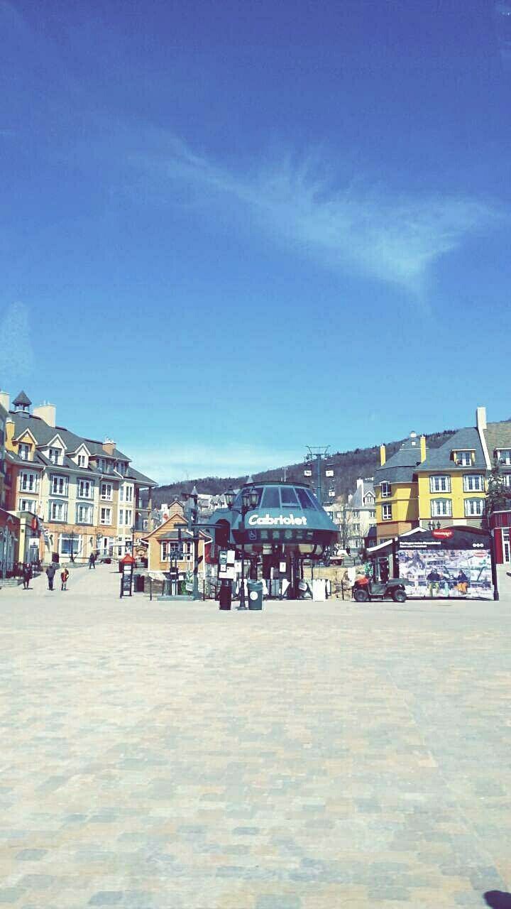 VIEW OF BUILDINGS AGAINST BLUE SKY