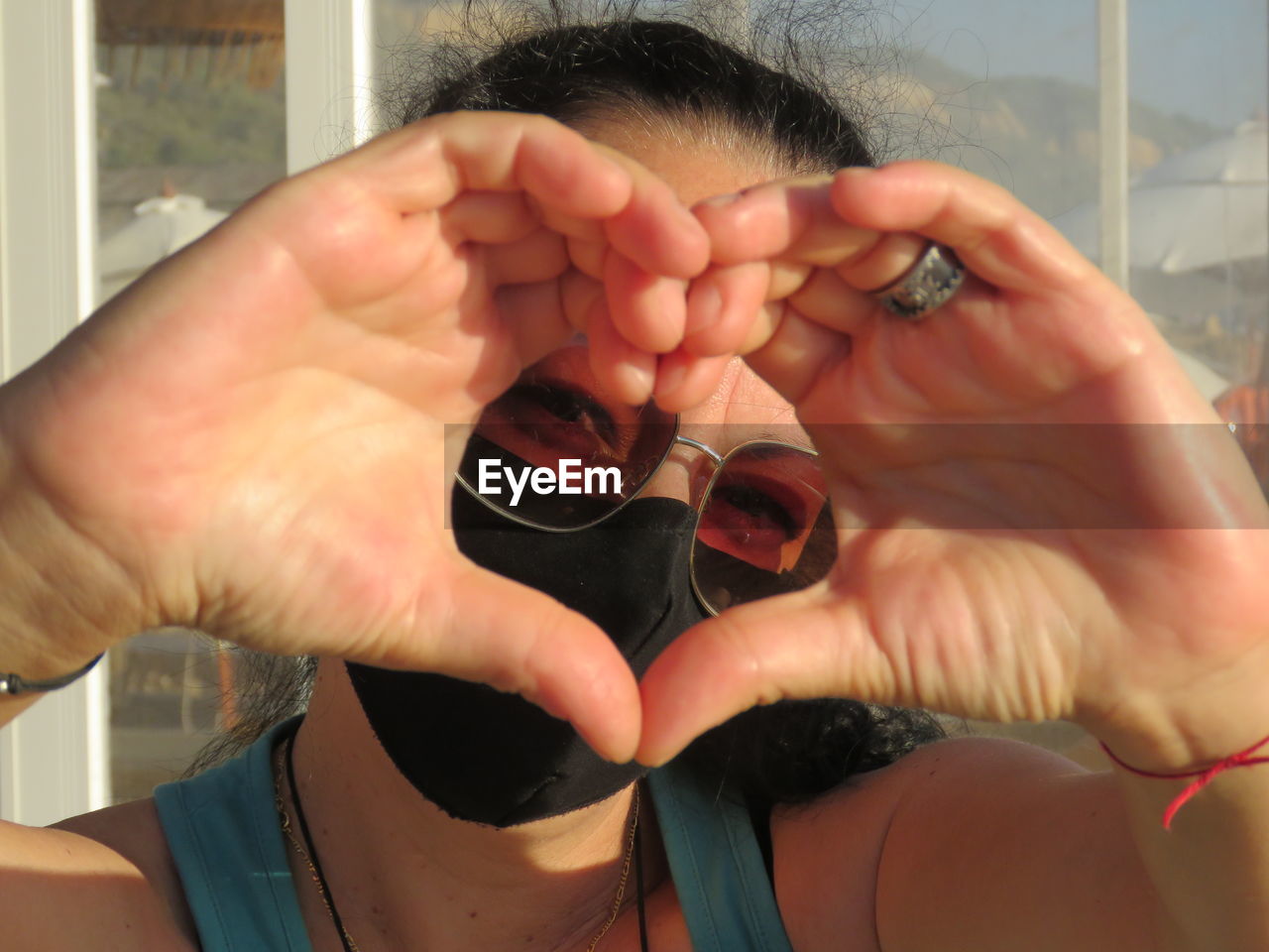 Heart shaped heads ar the beach on a sunny day