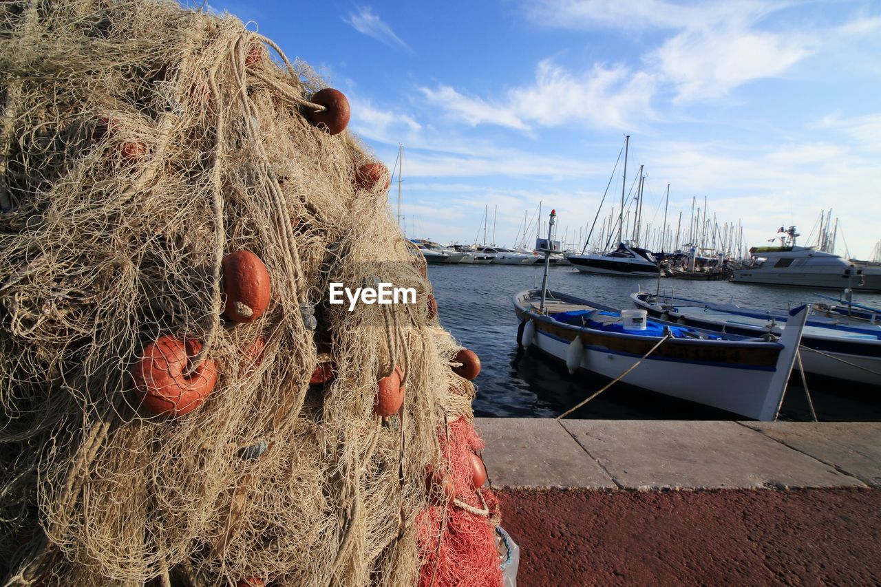 Fishing net with boats in background