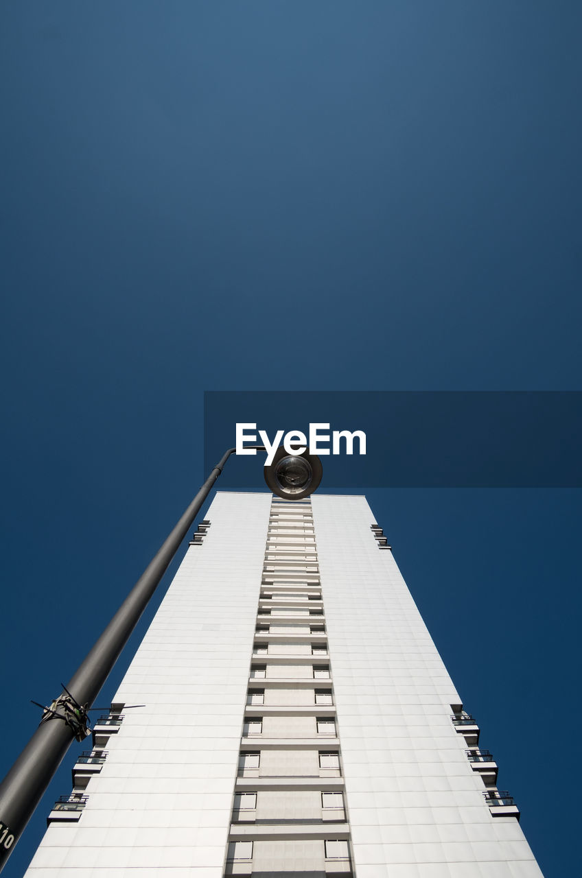 Low angle view of built structure against clear blue sky