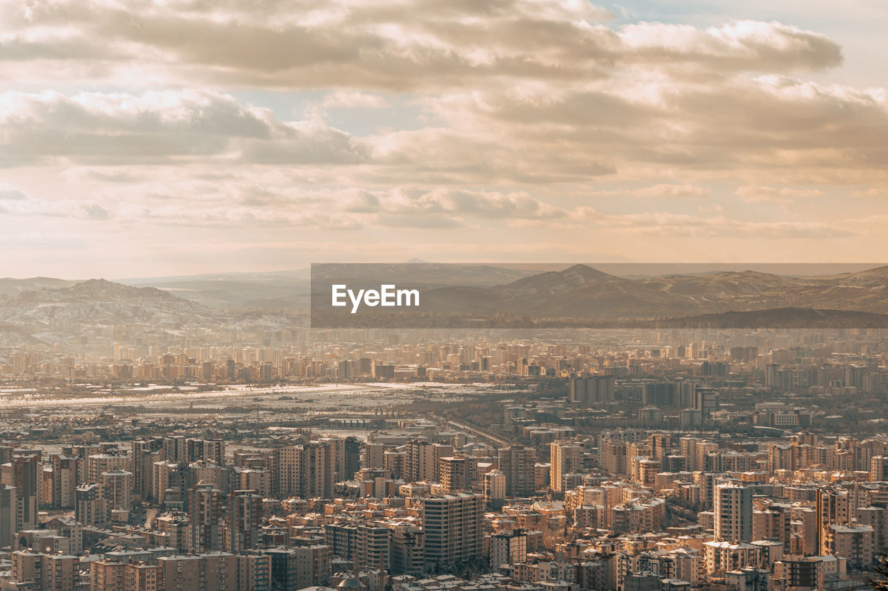 High angle view of buildings in city against sky