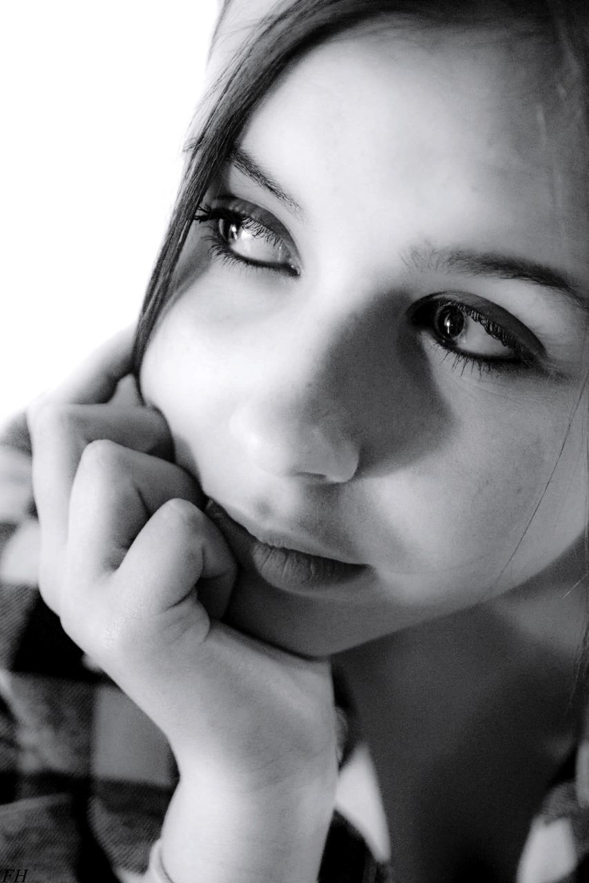 CLOSE-UP PORTRAIT OF YOUNG WOMAN WITH EYES CLOSED