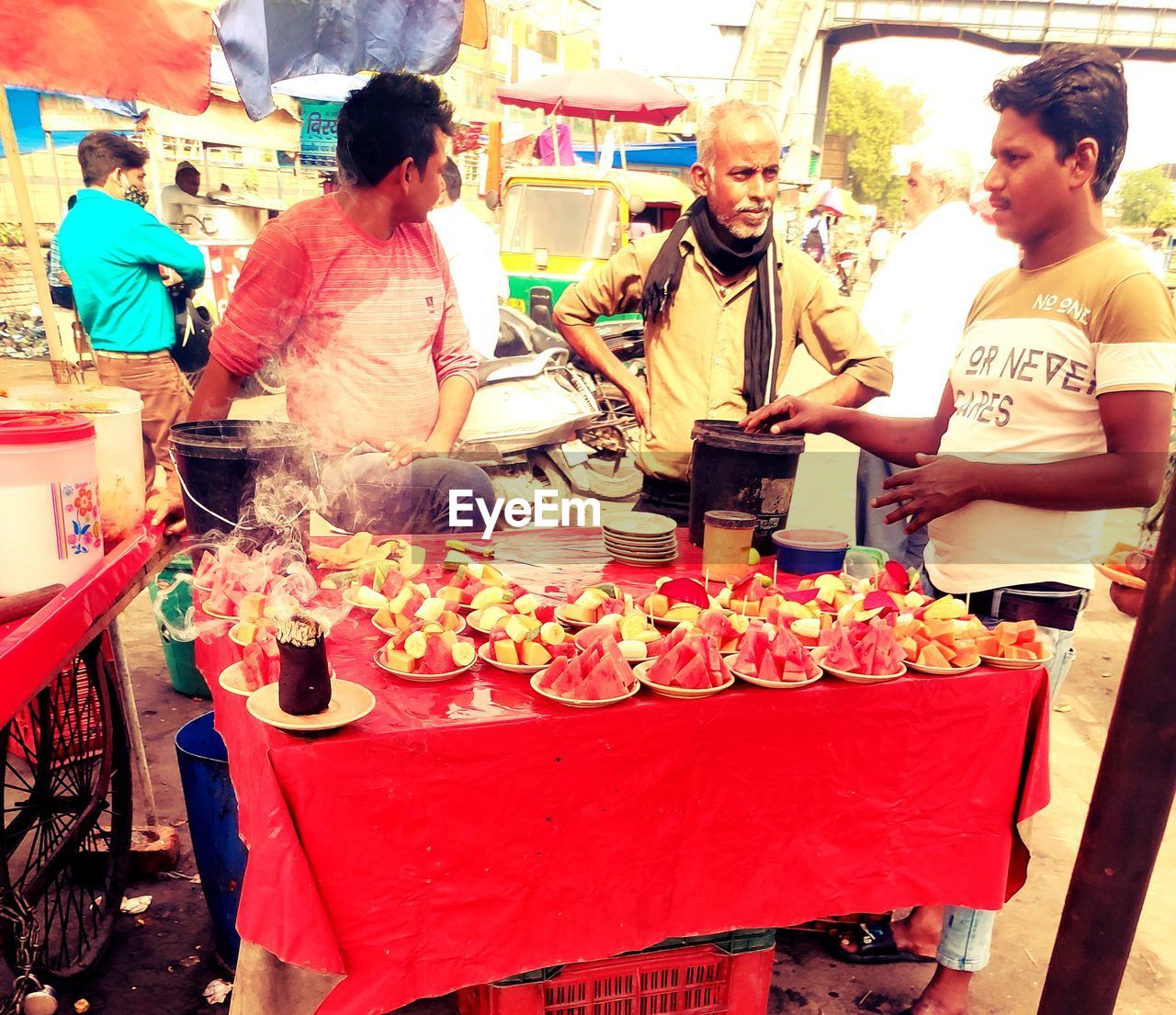 GROUP OF PEOPLE IN MARKET STALL