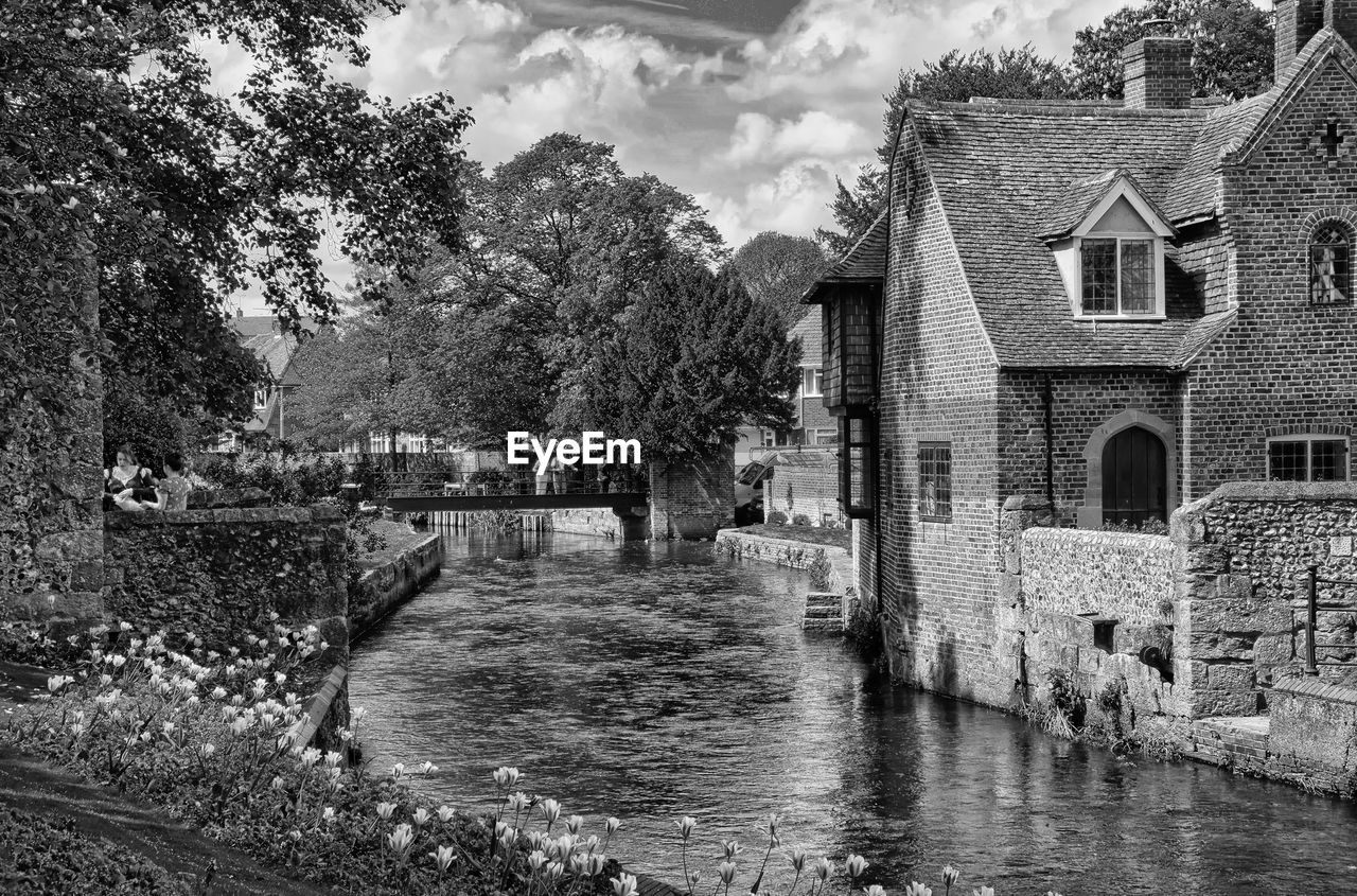 architecture, built structure, building exterior, water, building, black and white, tree, nature, plant, house, waterway, monochrome, cloud, monochrome photography, sky, residential district, day, rural area, canal, no people, outdoors