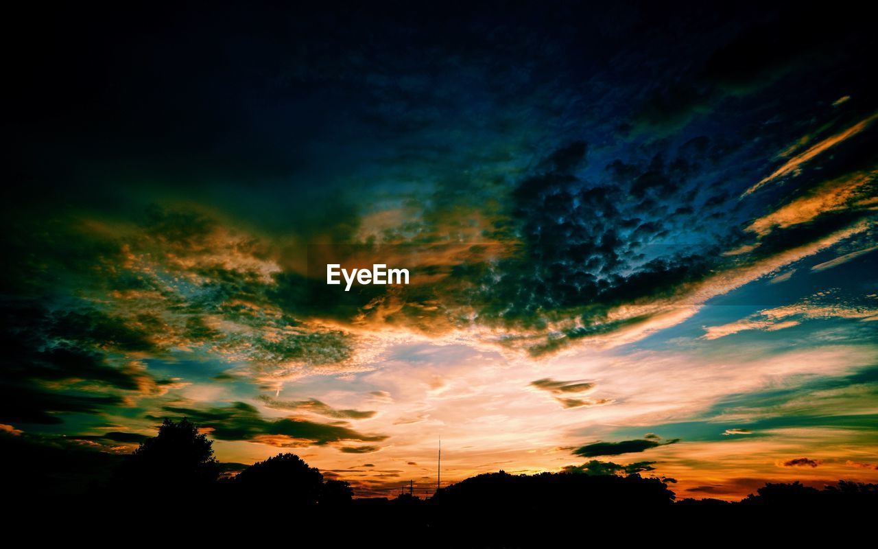 Scenic view of dramatic sky during sunset