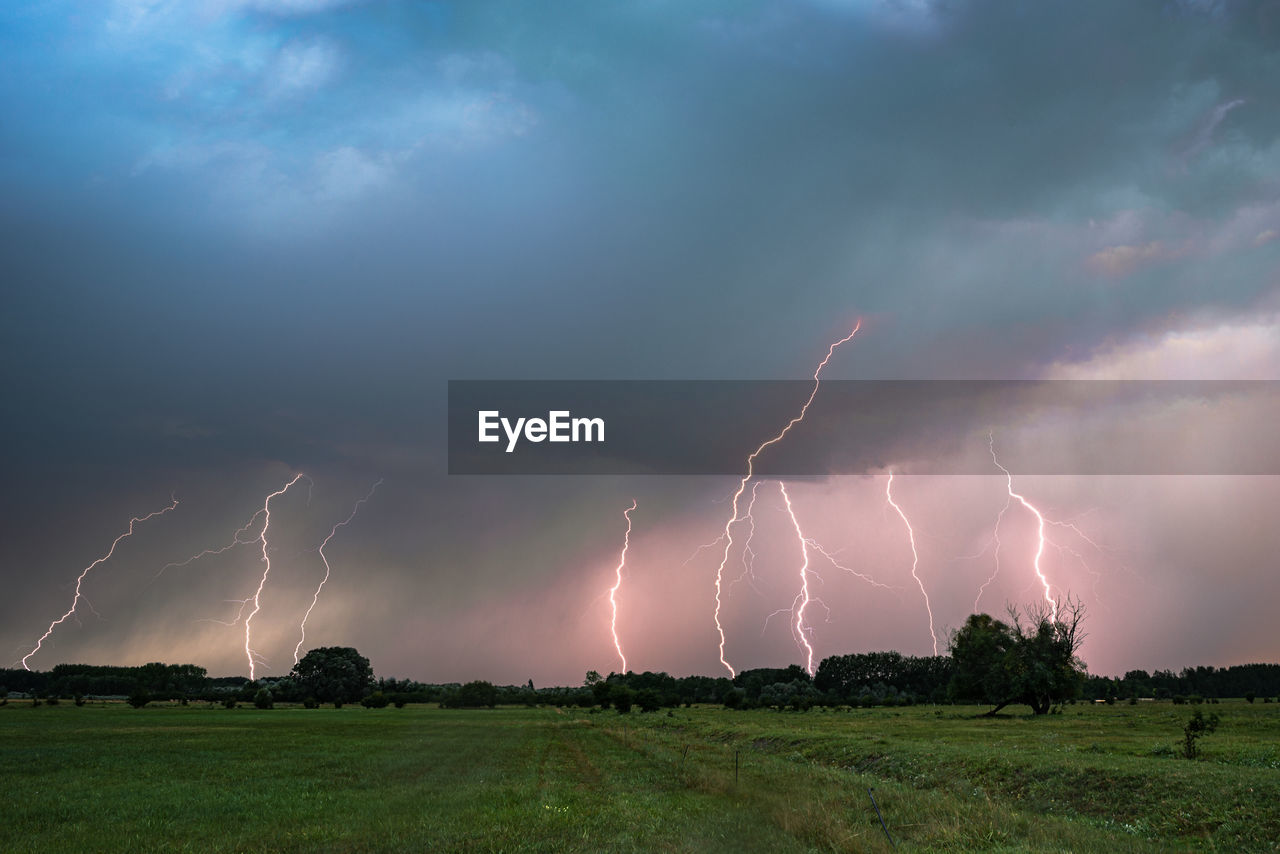 Composite of lightning bolts over the puszta or hungarian plains in the evening light