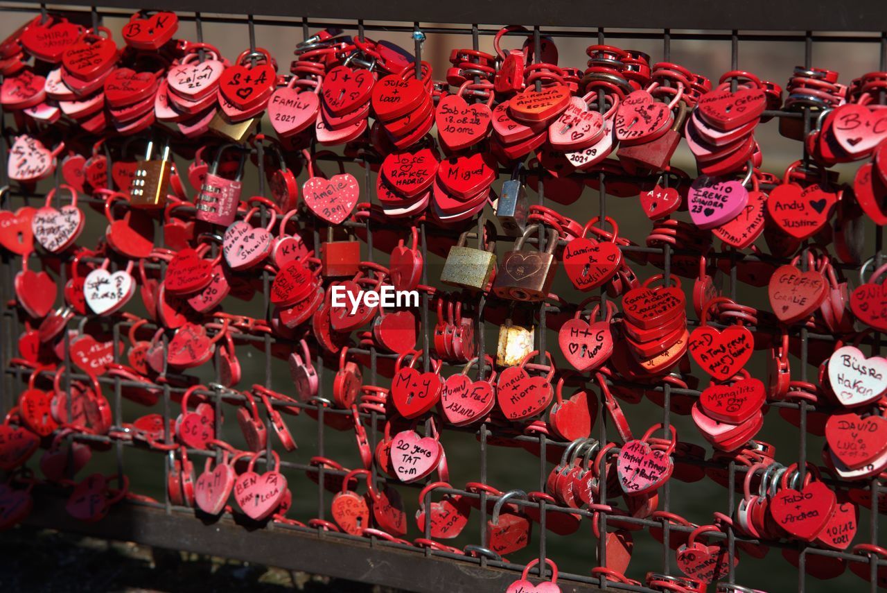 red, hanging, large group of objects, tradition, chinese new year, positive emotion, abundance, no people, love, valentine's day, heart shape, chinese lantern, emotion, festival, celebration, lantern, chinese lantern festival, flower, architecture, event, luck, in a row, decoration