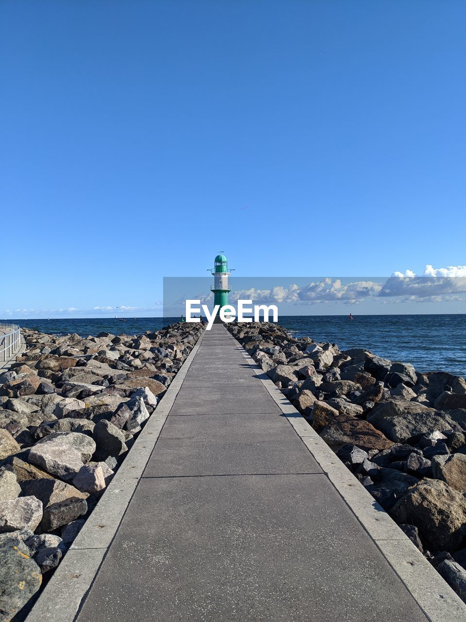 LIGHTHOUSE BY SEA AGAINST SKY