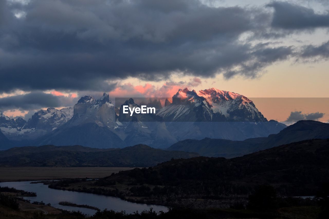 Scenic view of mountains against dramatic sky