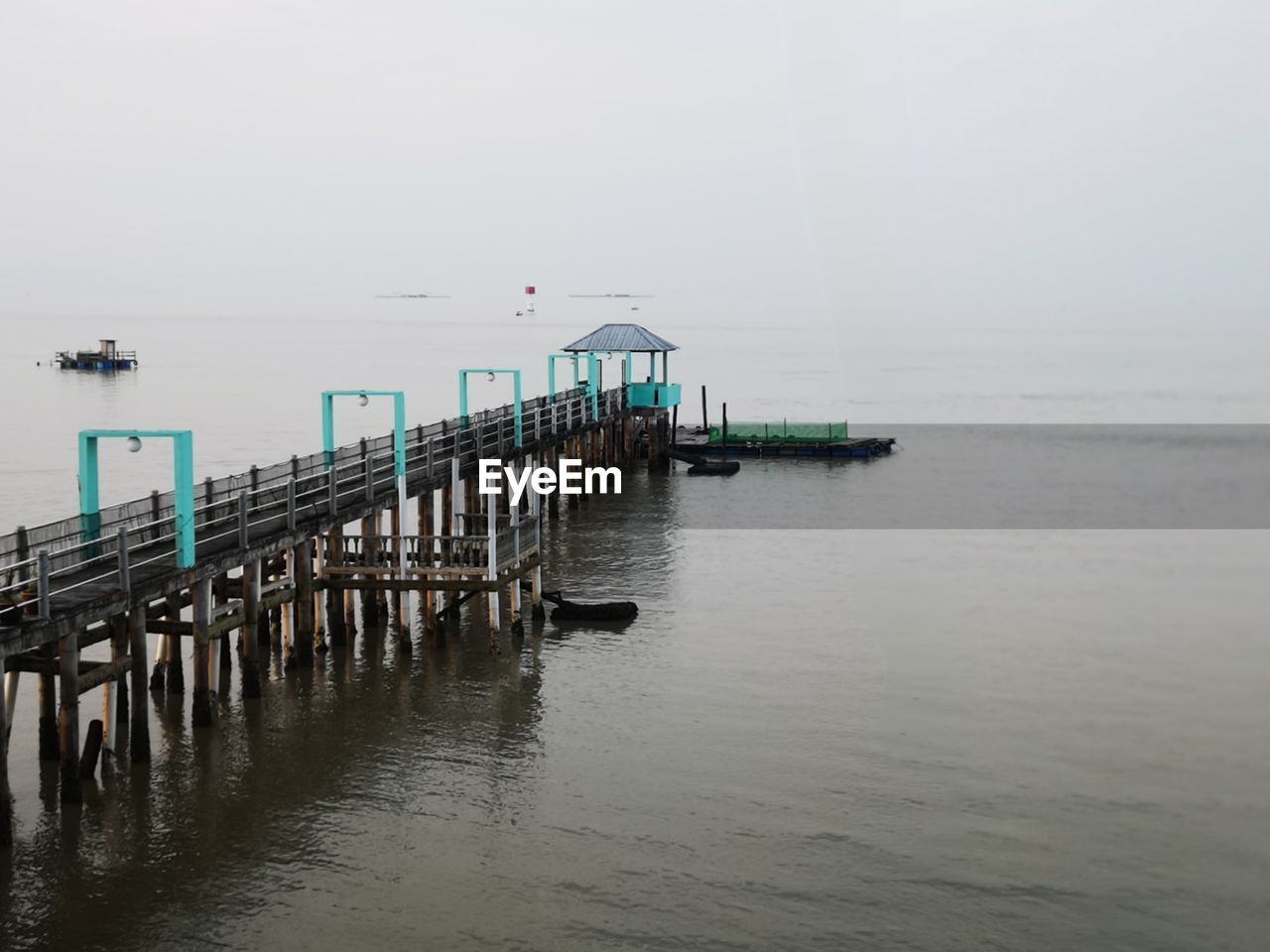 Pier over sea against clear sky