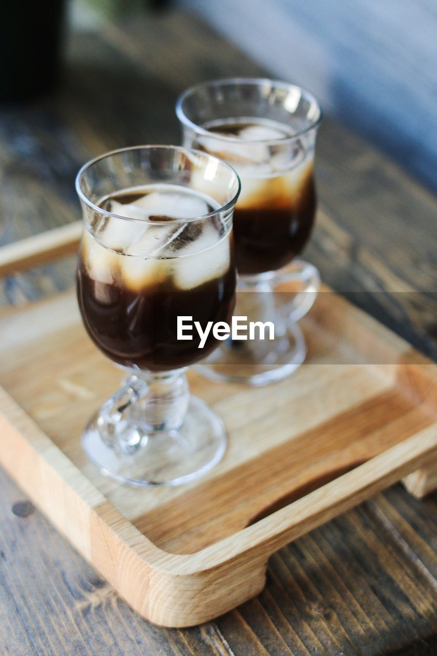 High angle view of ice coffee in glasses on table