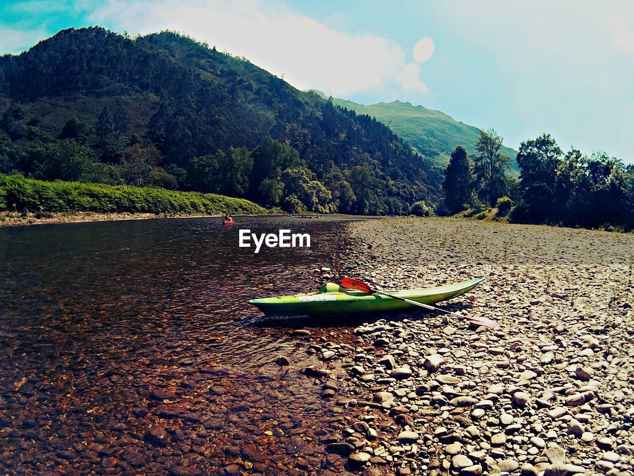 Boat on shore against sky