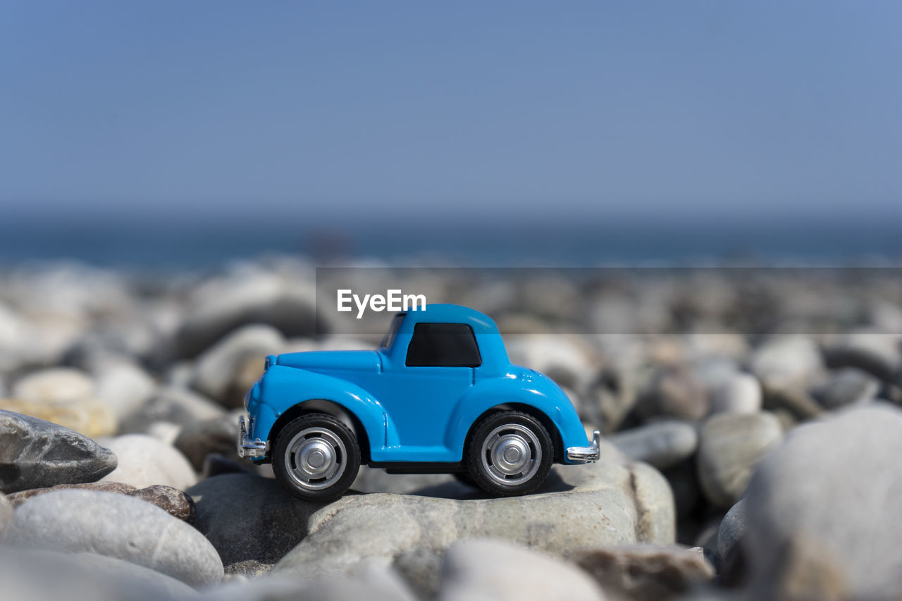 A car standing on the stones on the beach