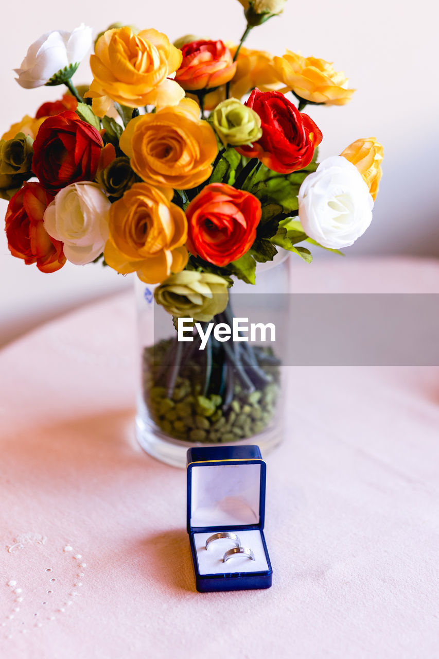 Close-up of roses in vase on table