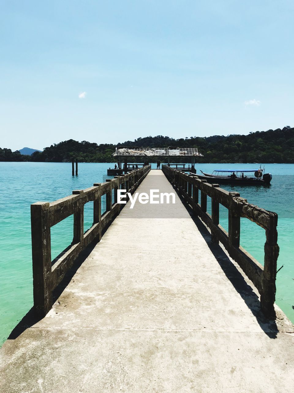 Pier over lake against sky