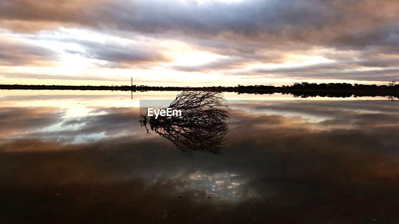 Scenic view of sea against dramatic sky