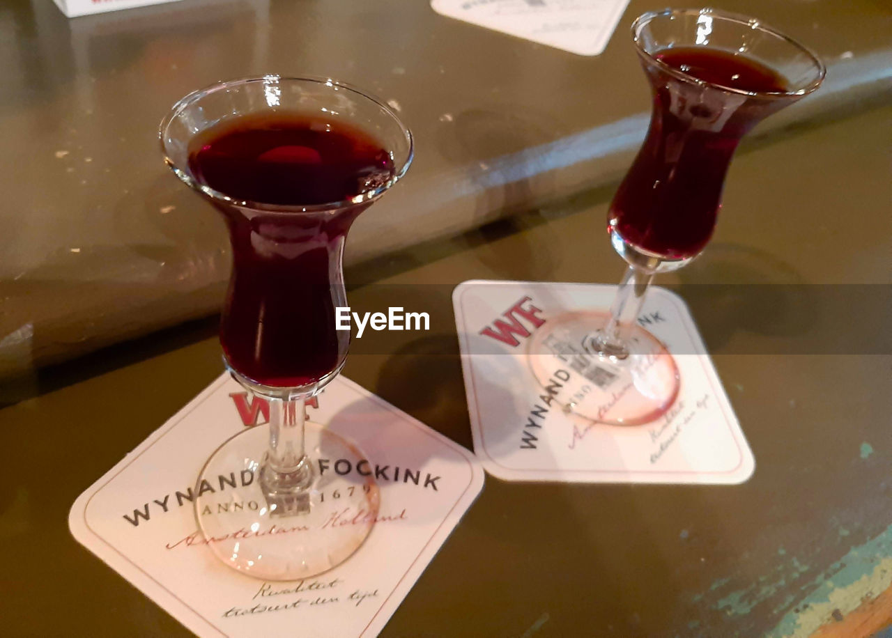 CLOSE-UP OF DRINK ON TABLE