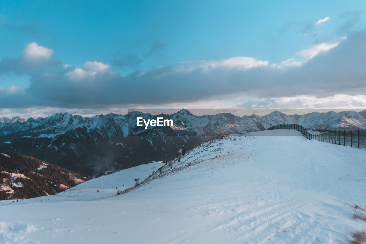 Scenic view of snowcapped mountains against sky