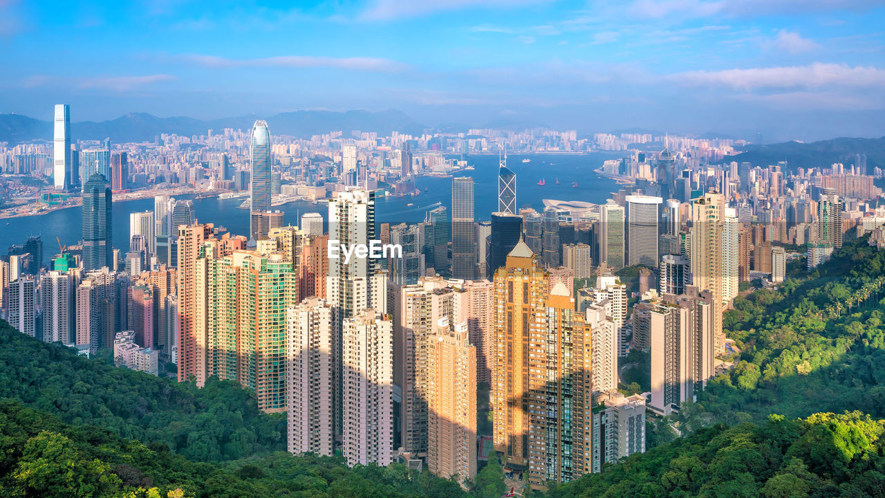 MODERN BUILDINGS IN CITY AGAINST SKY