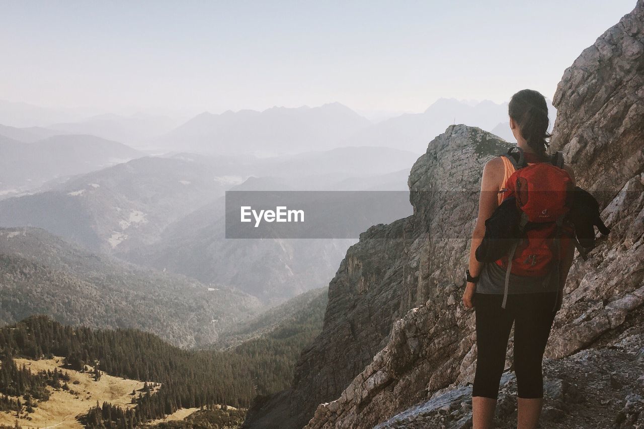 Rear view of man hiking on mountain