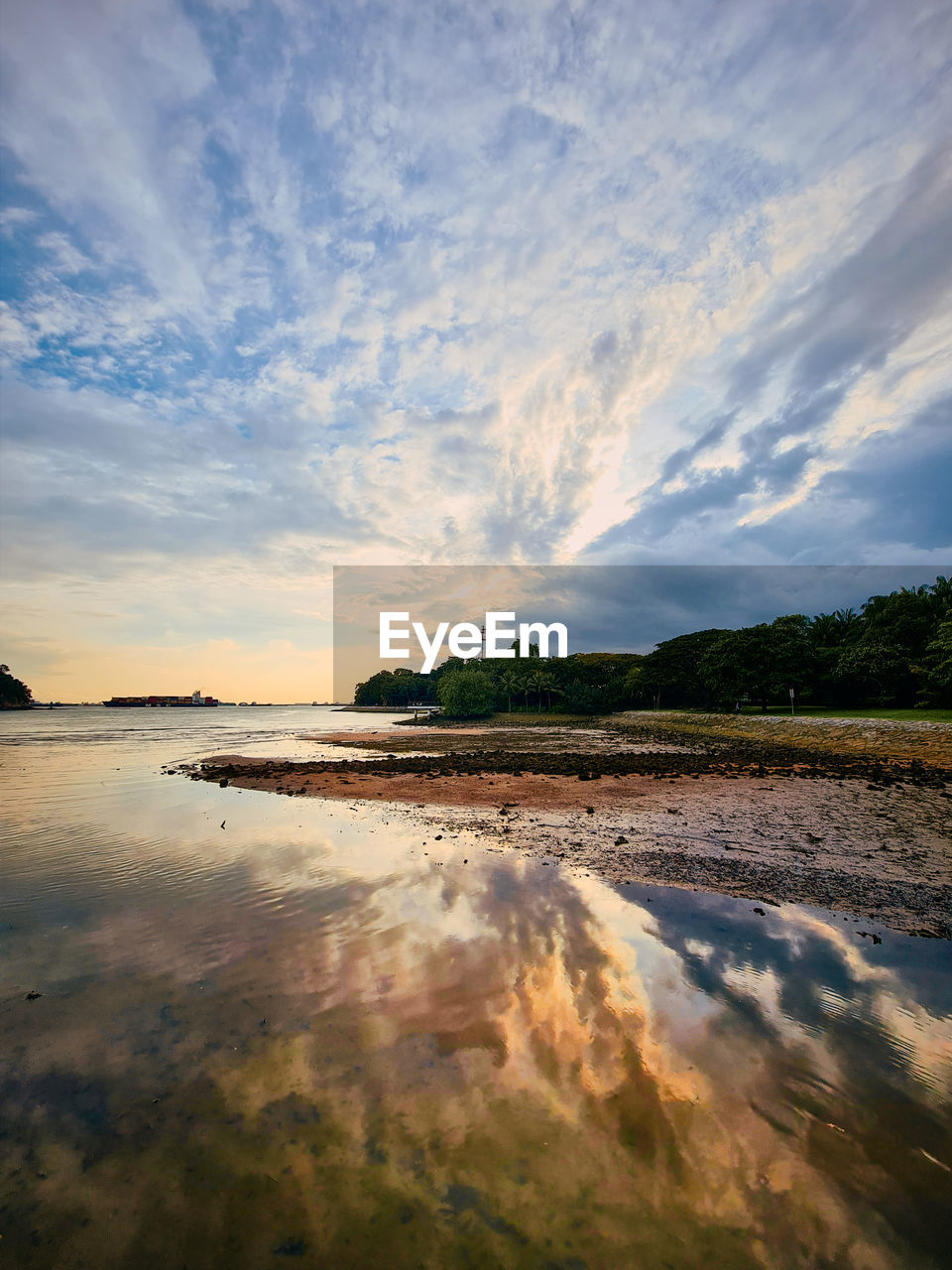 Scenic view of lake against sky during sunset with reflection during golden hour