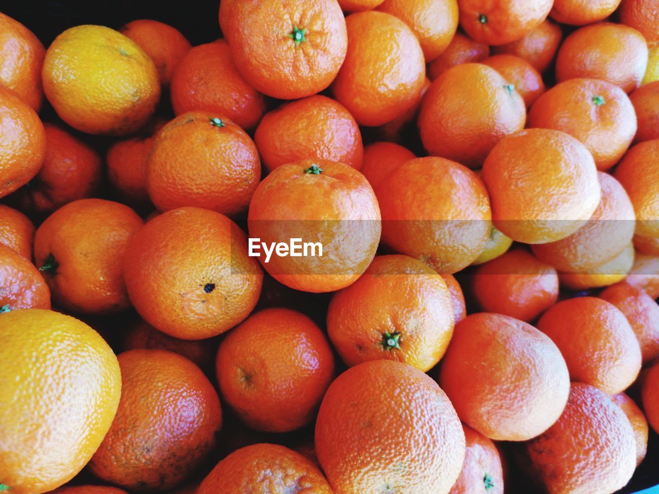 Full frame shot of oranges in market