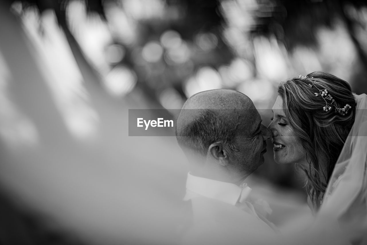 Portrait of couple kissing outdoors