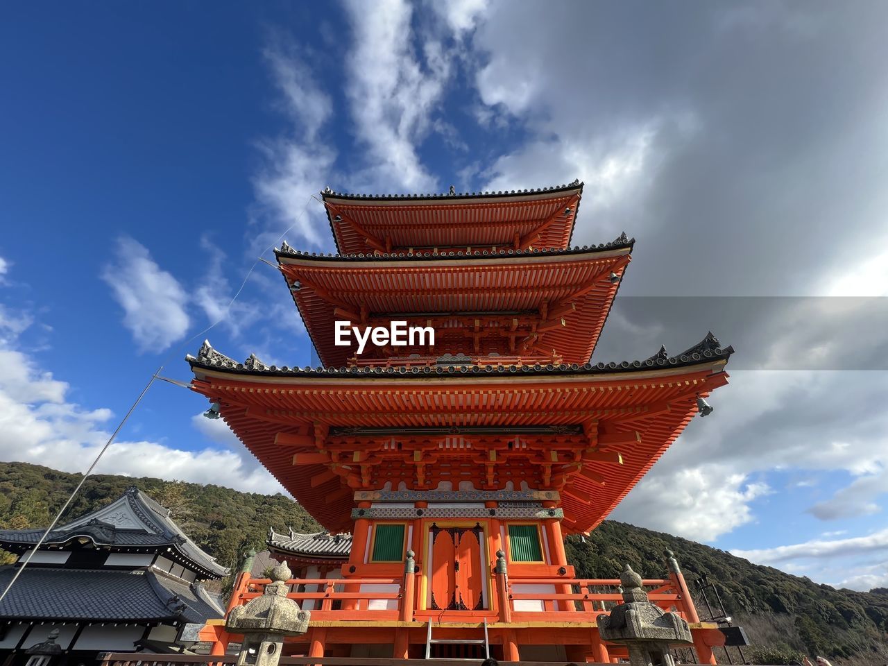 architecture, built structure, cloud, sky, religion, belief, temple - building, travel destinations, building, nature, building exterior, tower, history, spirituality, tradition, travel, chinese architecture, the past, landmark, temple, place of worship, tourism, no people, outdoors, ancient, landscape, roof, red, environment, pagoda, day, city, beauty in nature, blue
