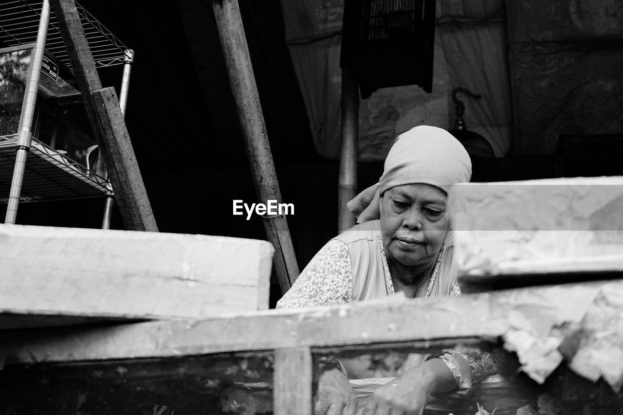 Low angle view of woman working at construction site