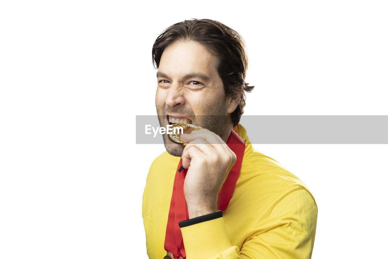 PORTRAIT OF MID ADULT MAN OVER WHITE BACKGROUND