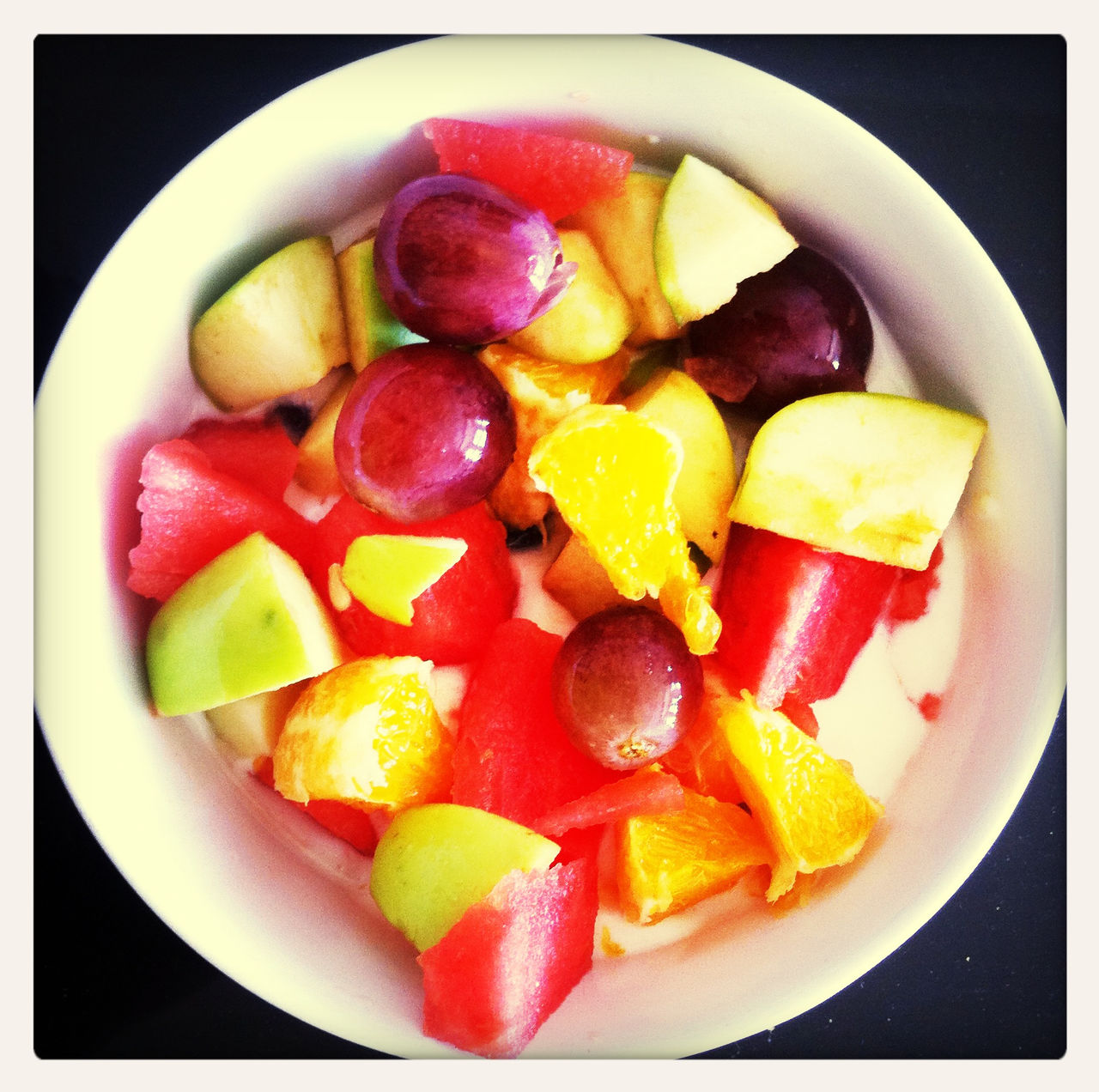 Close-up of fruit salad served on table