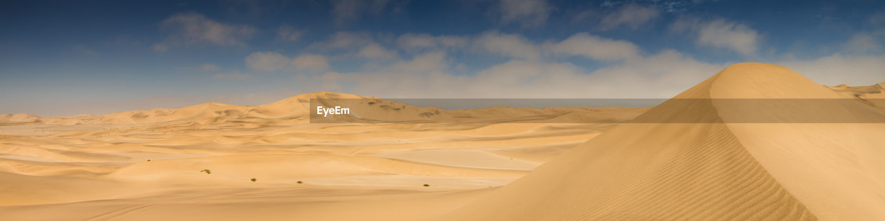 Panoramic view of desert against sky