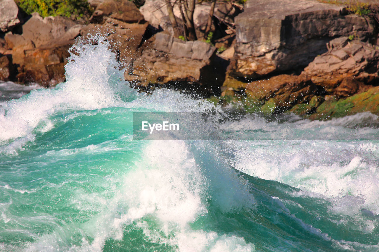 Sea waves splashing on rocks
