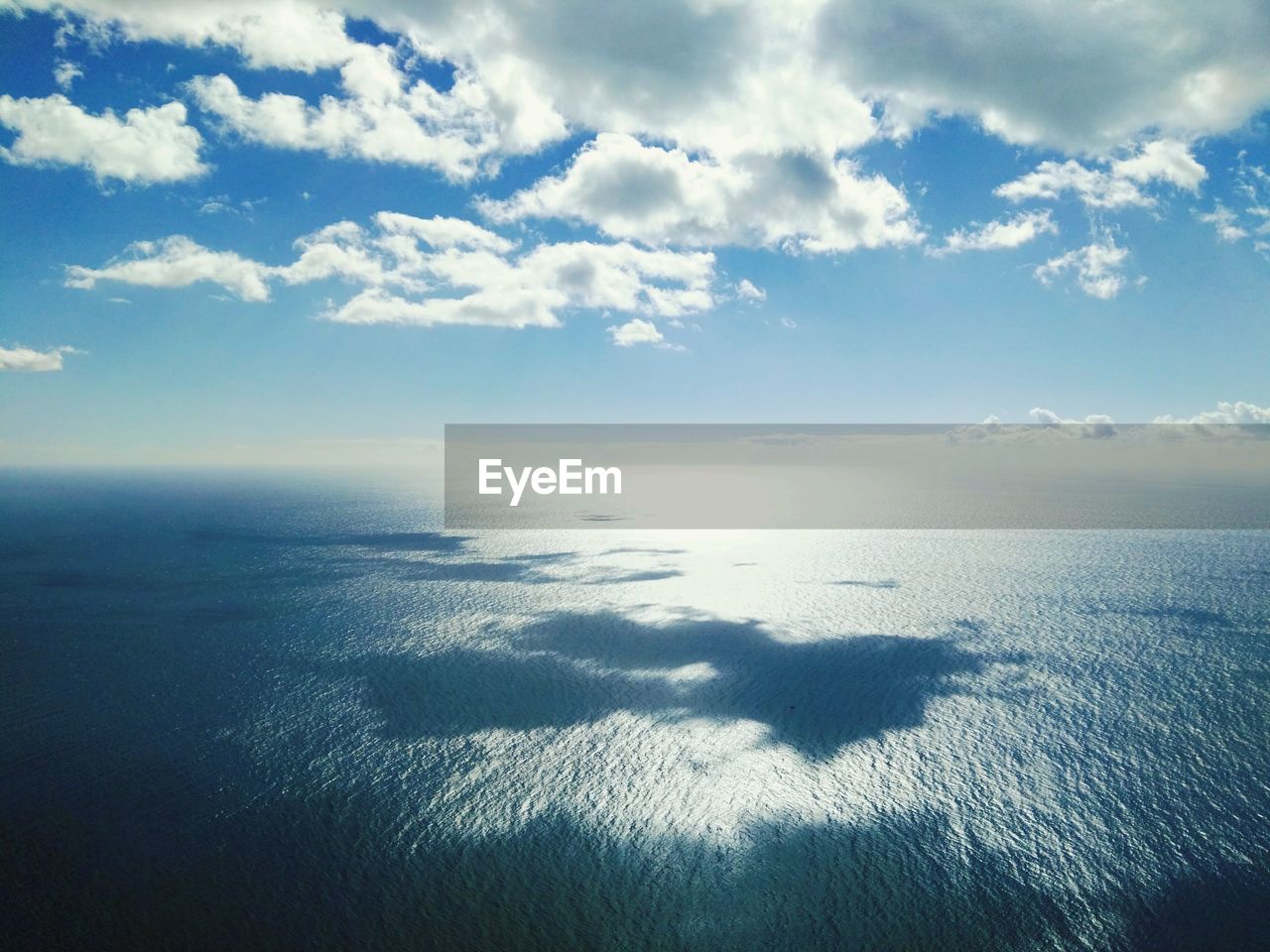 REFLECTION OF SKY ON SEA