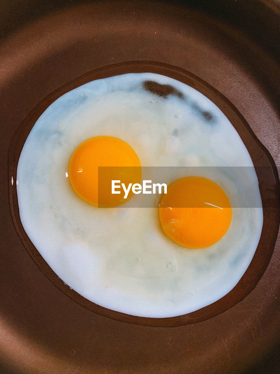 Directly above shot of sunny side up in frying pan