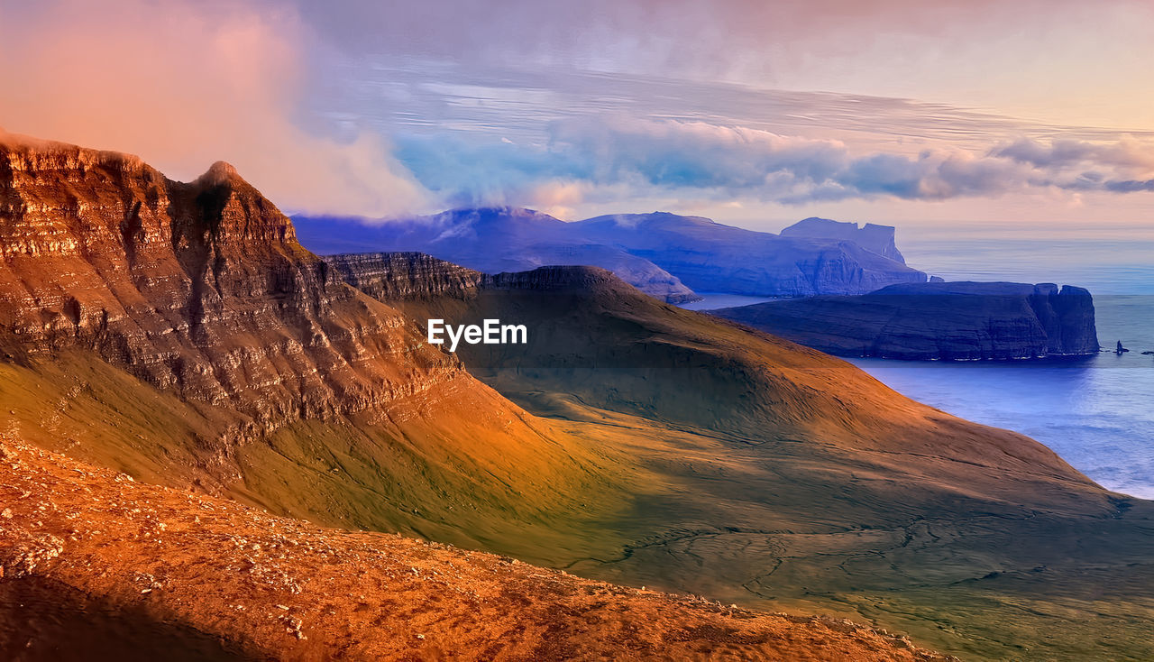 Panoramic view of the sea in the mountains. nordic islands,greenland,faroer,iceland with sunset
