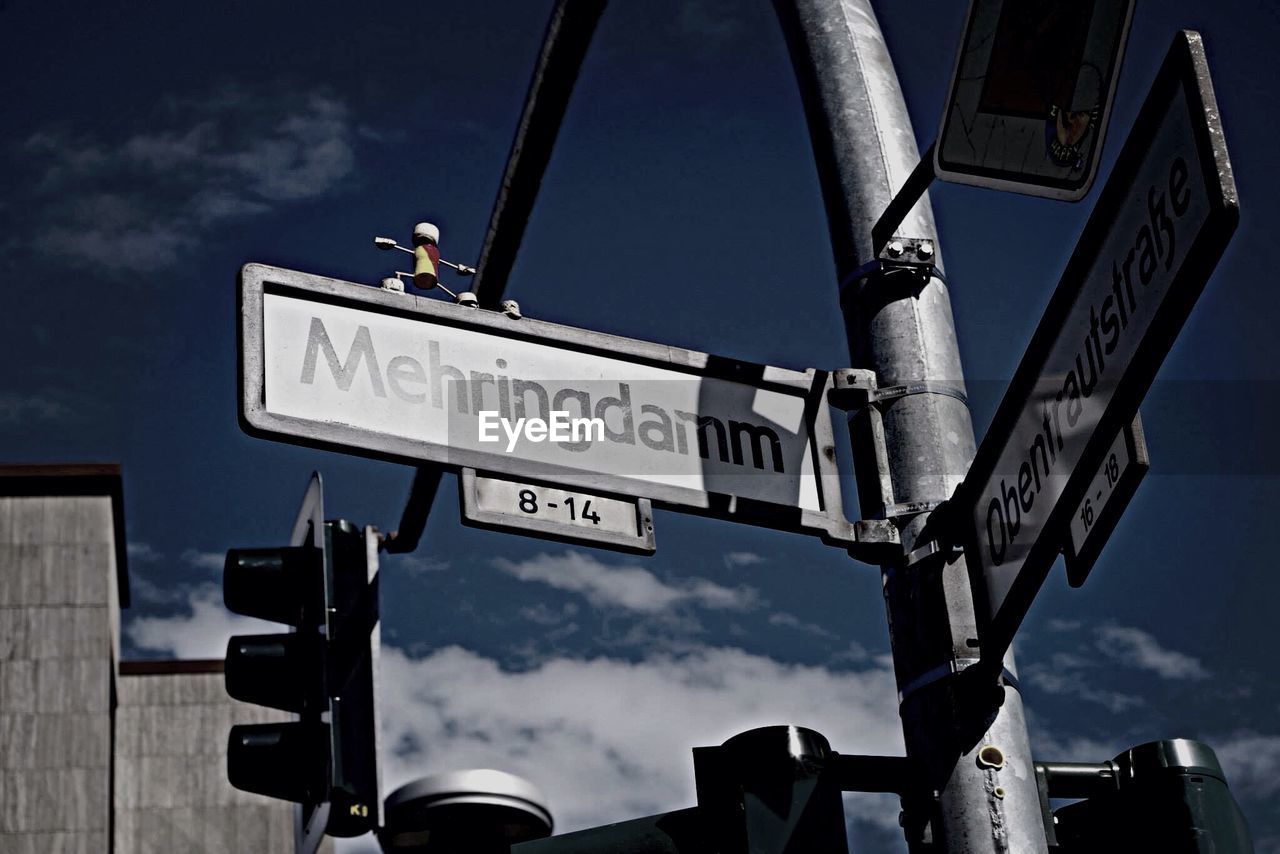 LOW ANGLE VIEW OF ROAD SIGNS AGAINST SKY