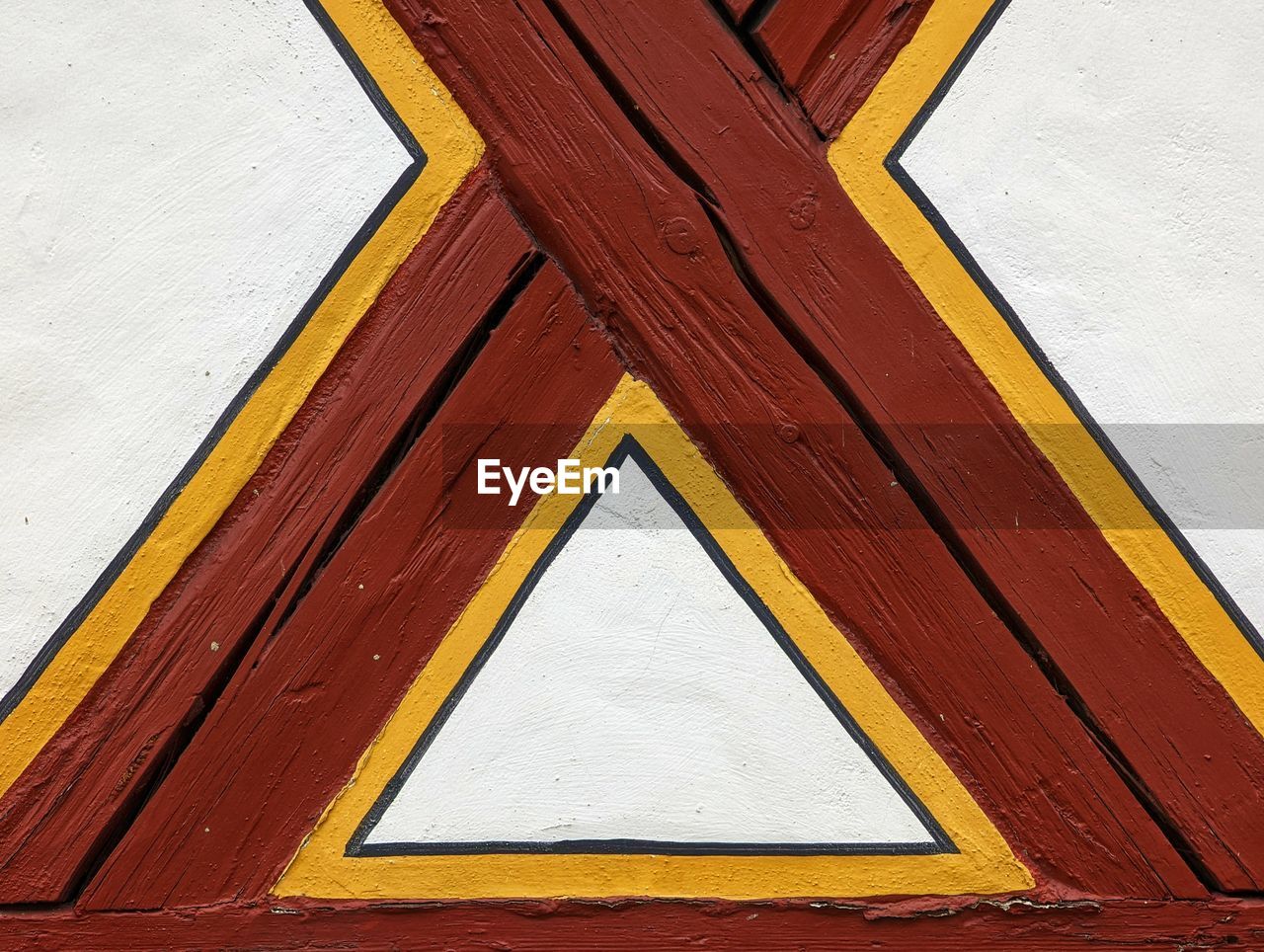 yellow, wood, no people, red, architecture, built structure, full frame, hardwood, floor, pattern, shape, day, wall - building feature, close-up, backgrounds, window, building exterior, textured, geometric shape, wood stain, outdoors, wall, multi colored, brown, flooring