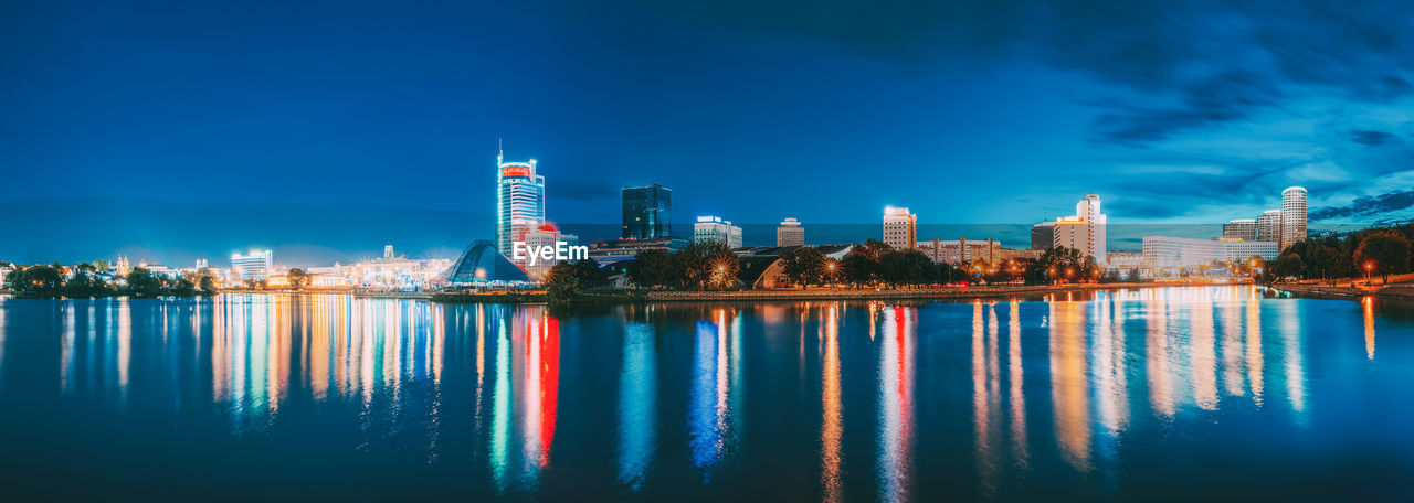 reflection of illuminated buildings in water