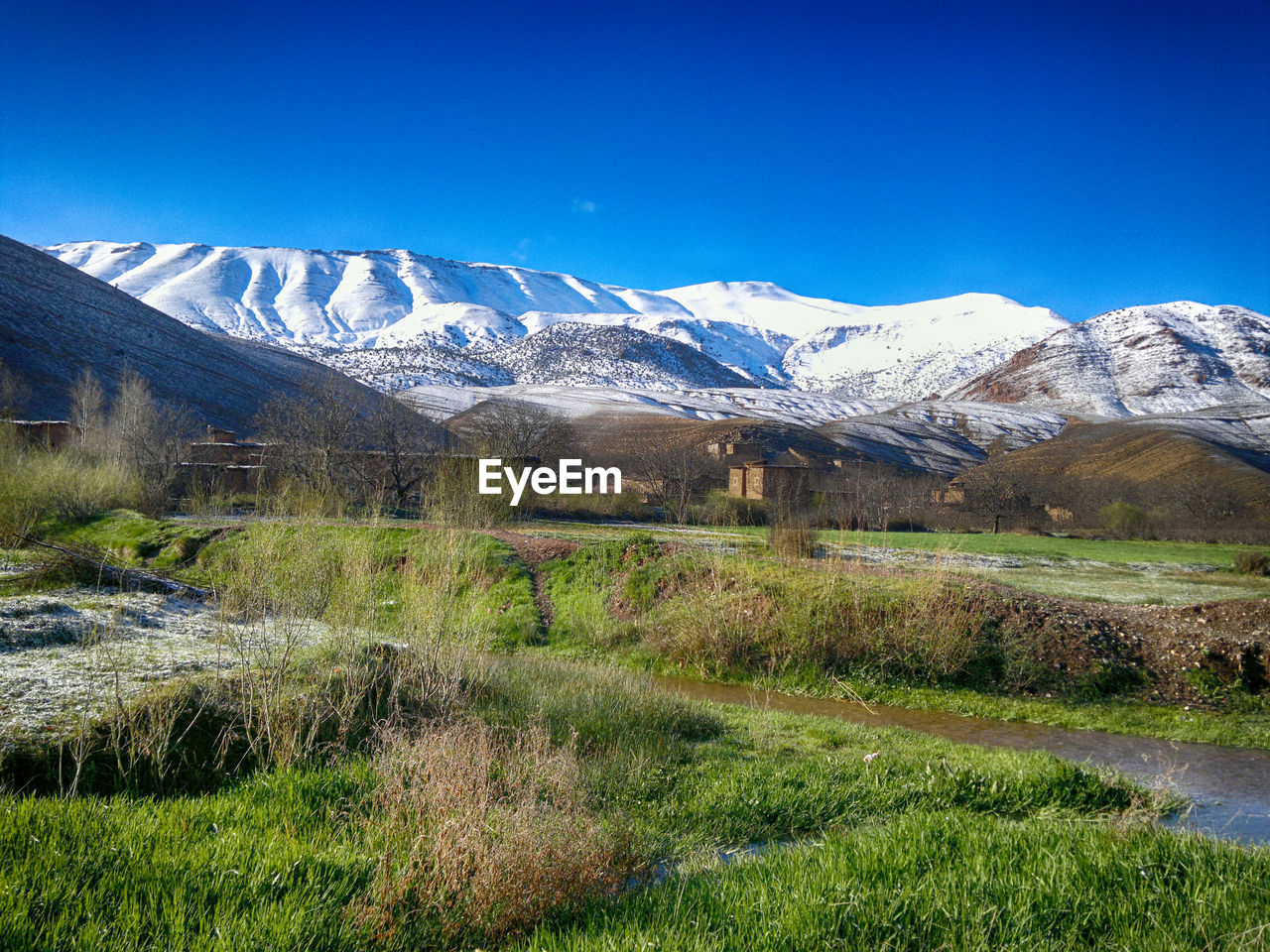 SCENIC VIEW OF MOUNTAINS AGAINST BLUE SKY