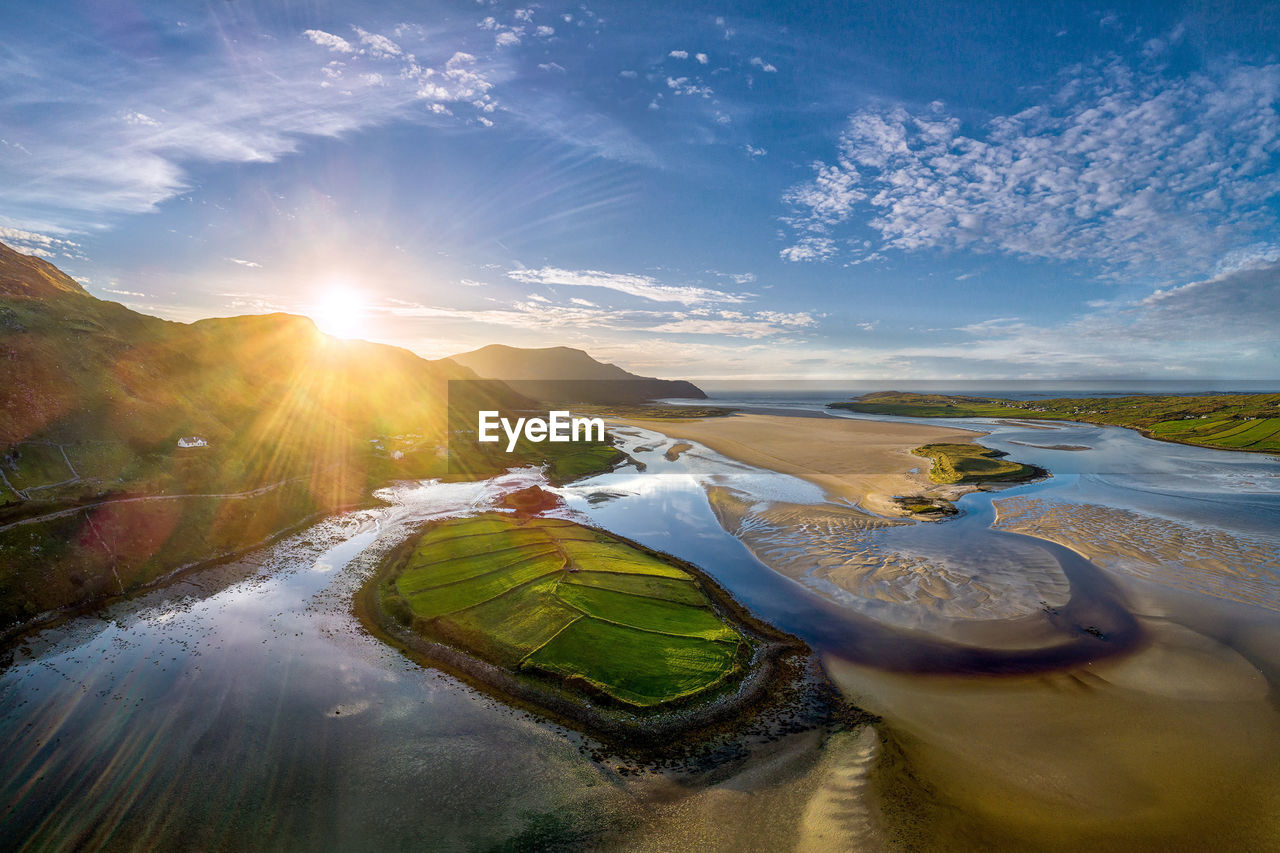 SCENIC VIEW OF LANDSCAPE AGAINST BRIGHT SUN