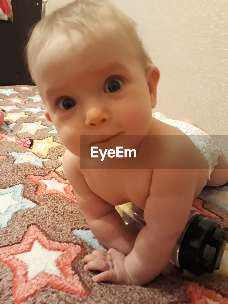 PORTRAIT OF CUTE BABY GIRL AT HOME