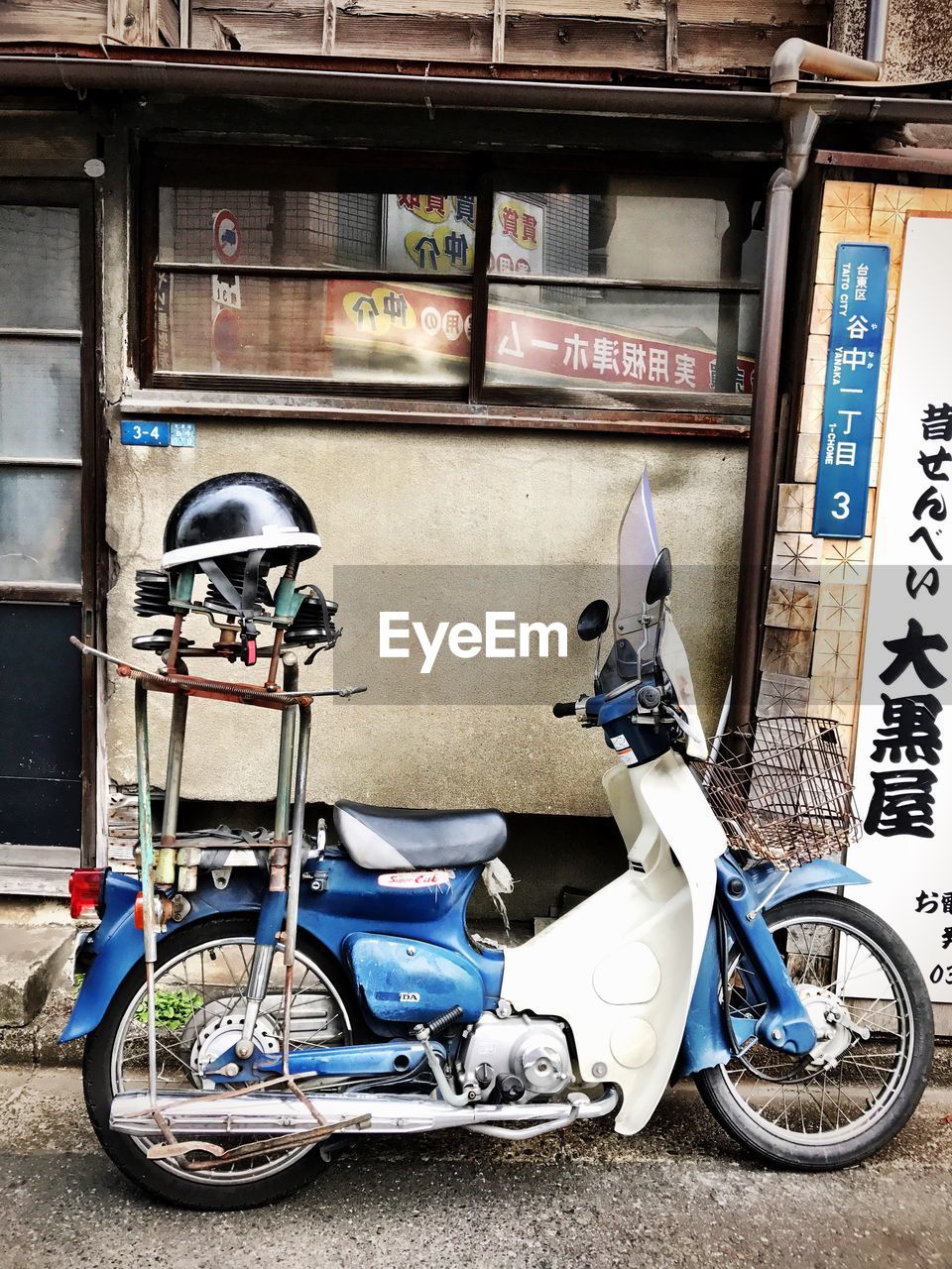 Motorcycle parked against building