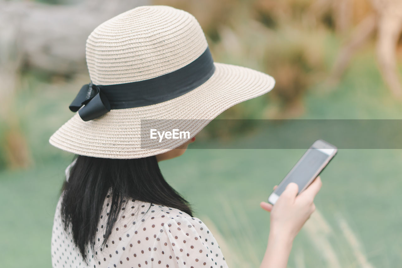 Woman using mobile phone outdoors