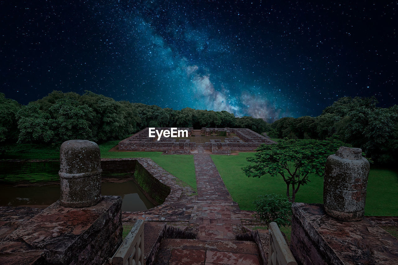 Built structure against sky at night in sanchi heritage complex